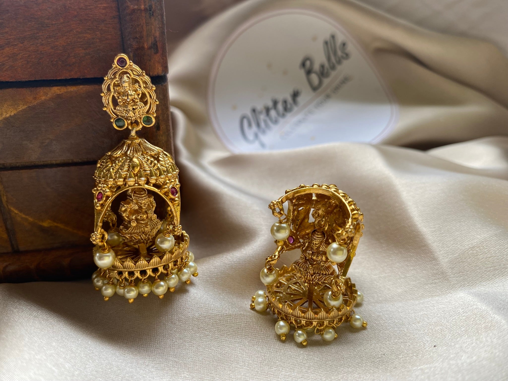 Antique temple-style earrings with deity motifs. Perfect for bridal, festive, and traditional wear