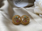 Antique gold finish with detailed peacock motifs