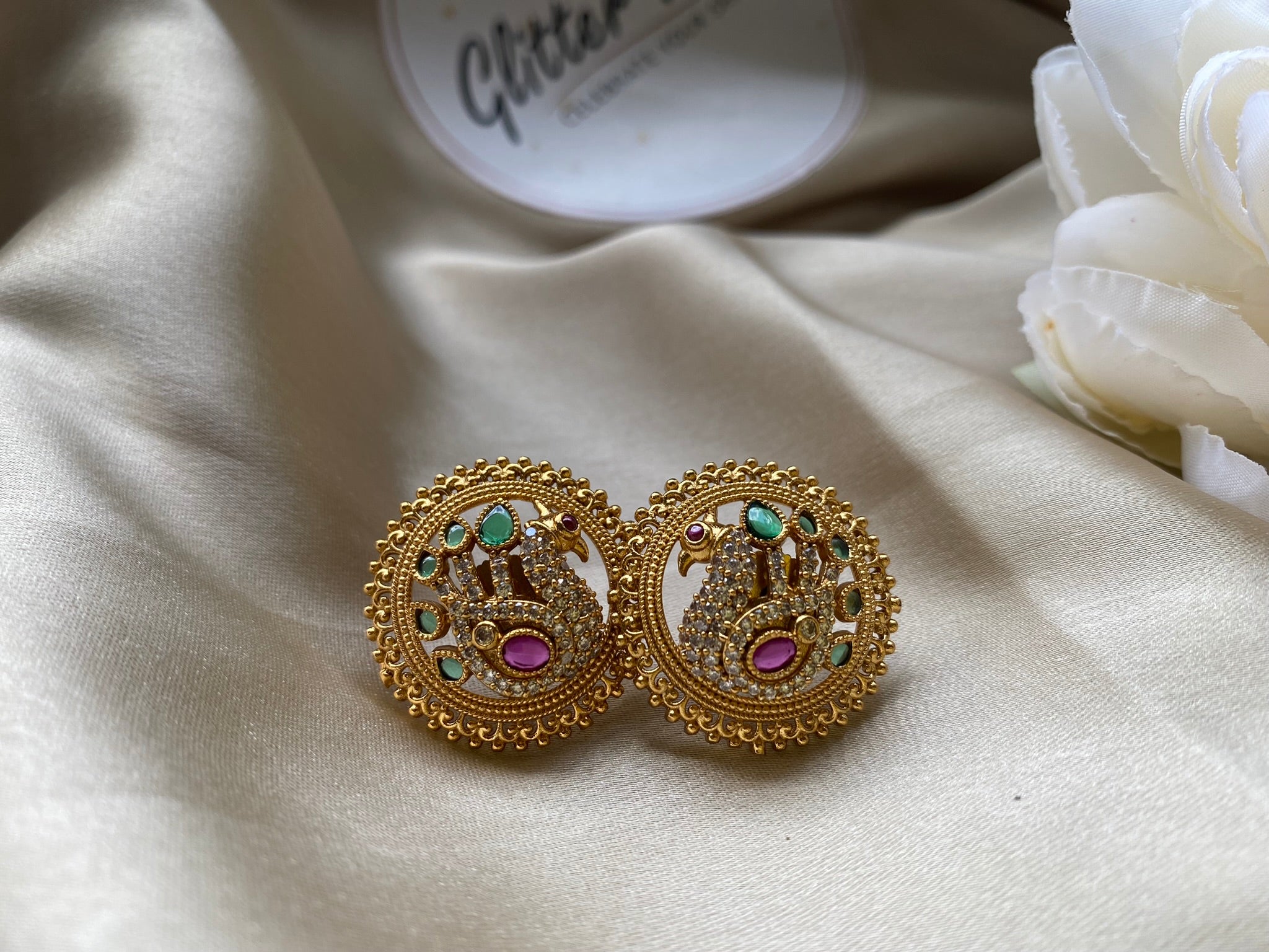 Antique gold finish with detailed peacock motifs