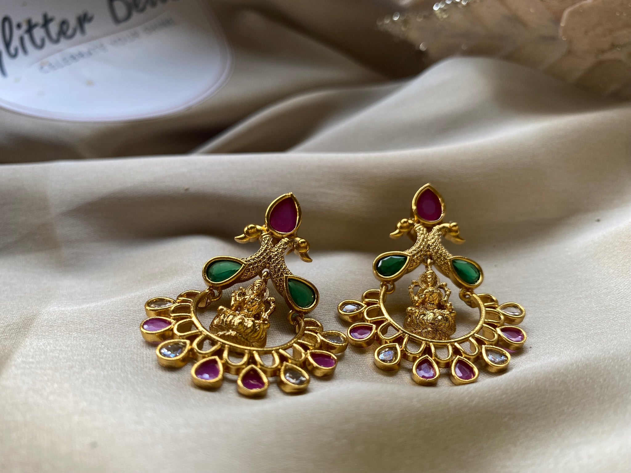Temple-inspired Chandbali design with deity motif