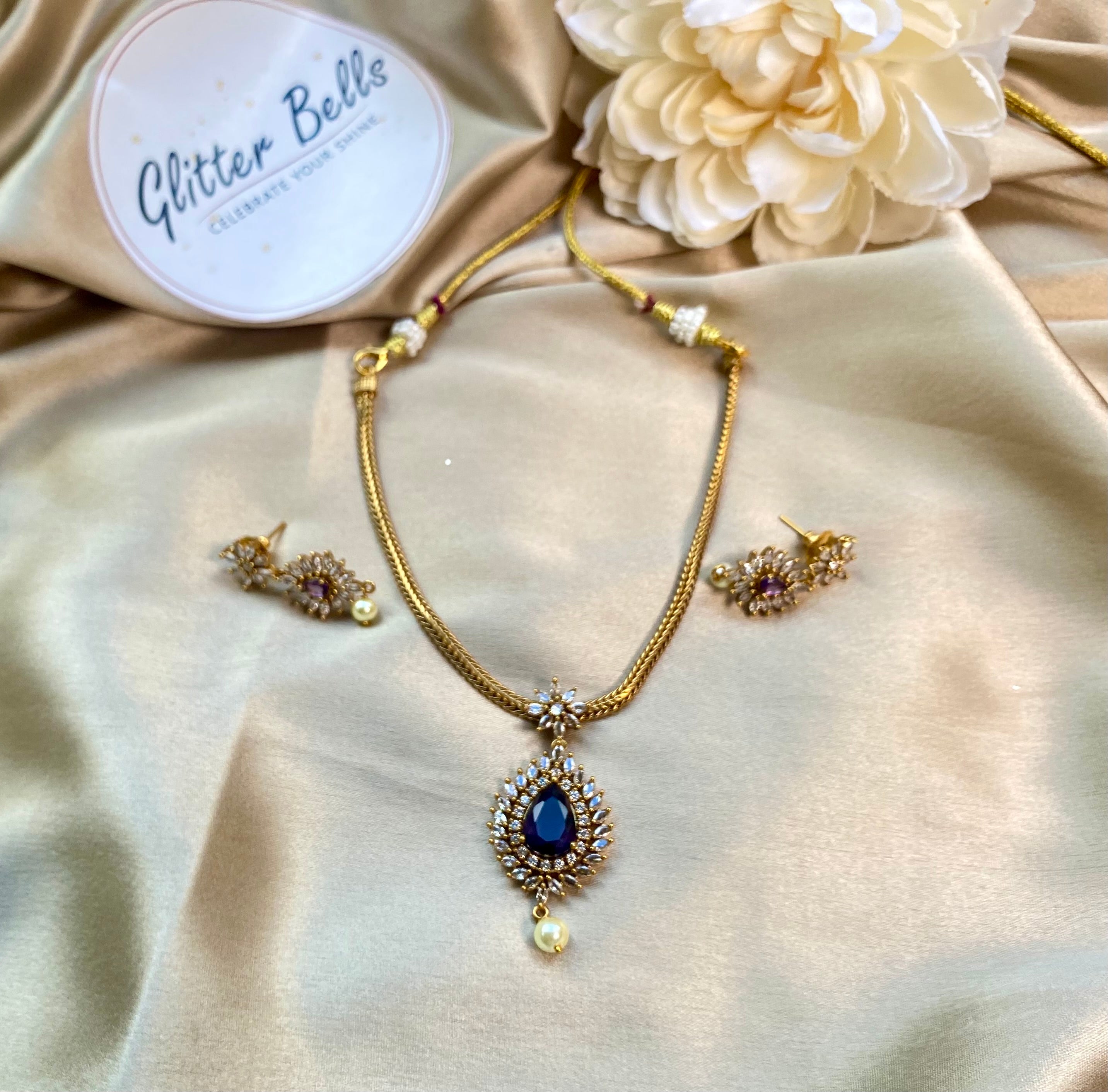 Gold-plated necklace with teardrop blue stone pendant