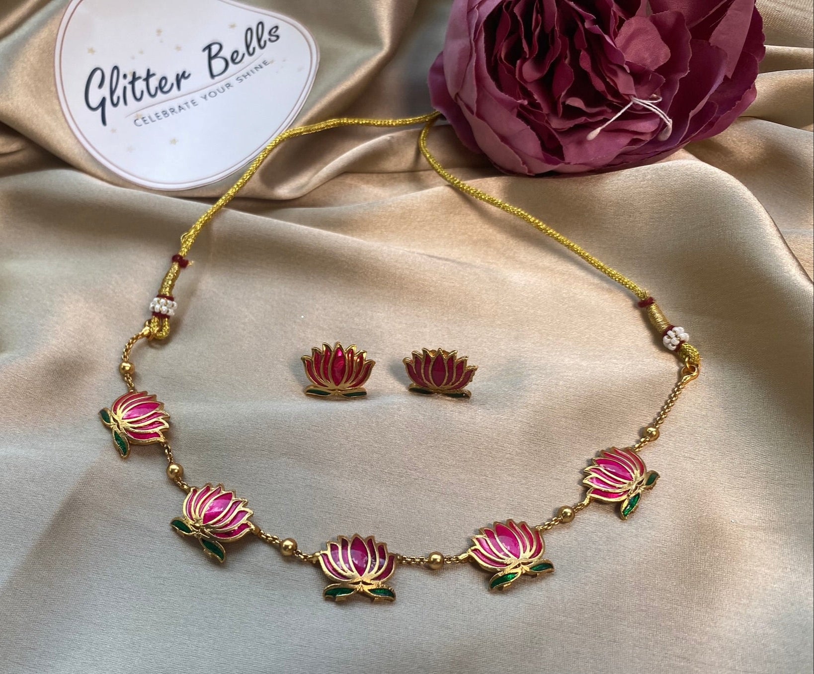 Gold-toned chain with pink lotus motifs