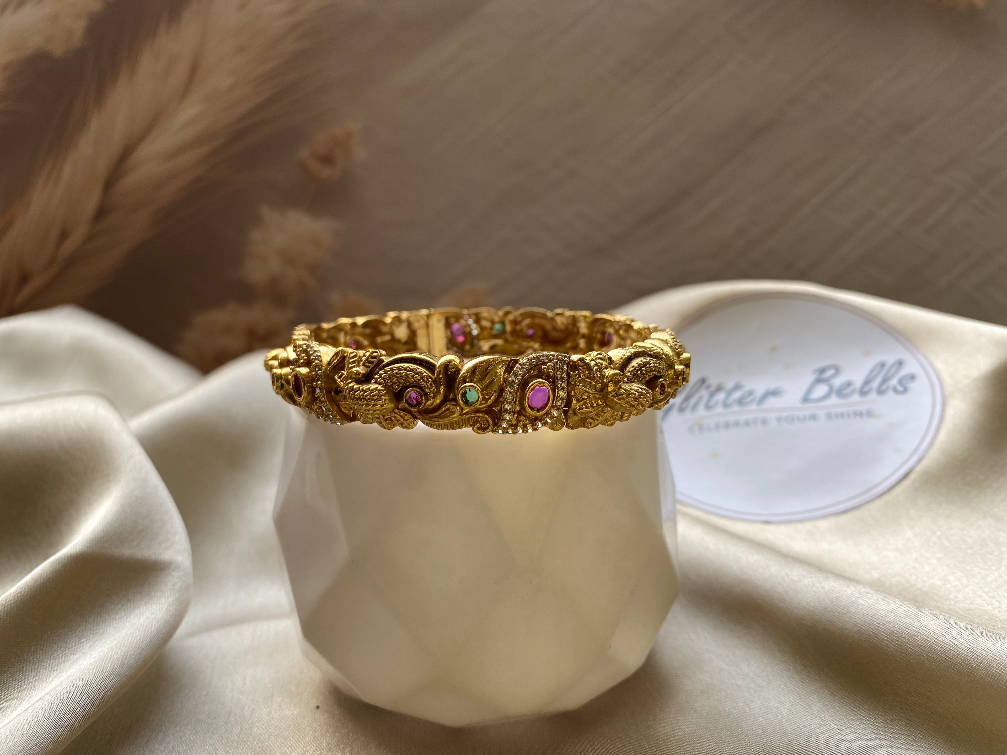 Antique gold-finish temple-style bangle