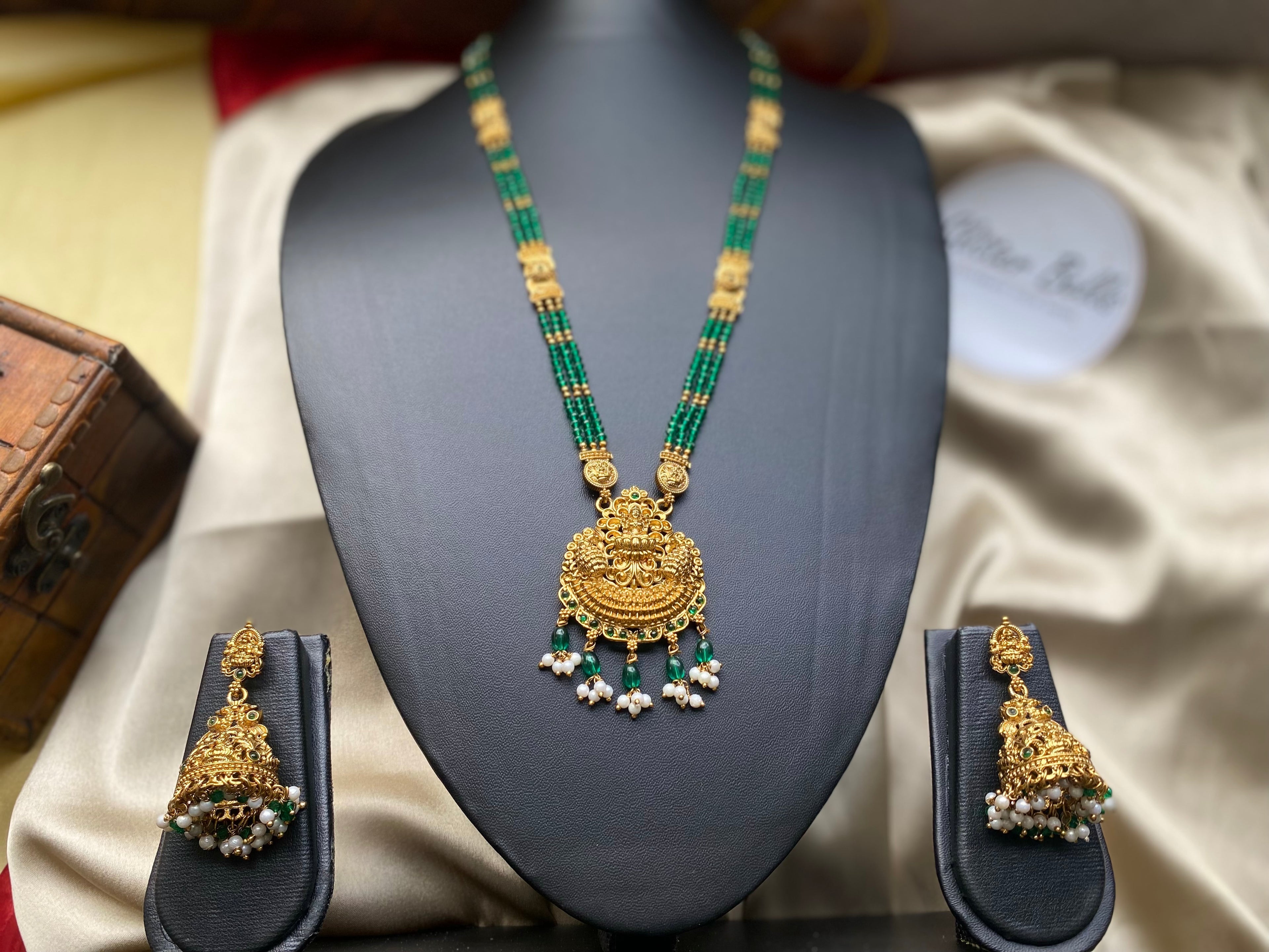 Temple-style pendant with divine motifs