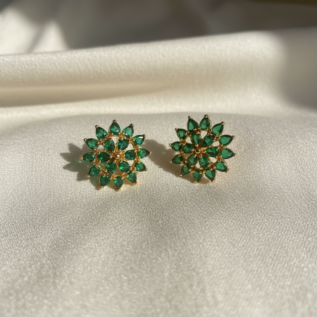 Emerald starburst earrings with elegant background