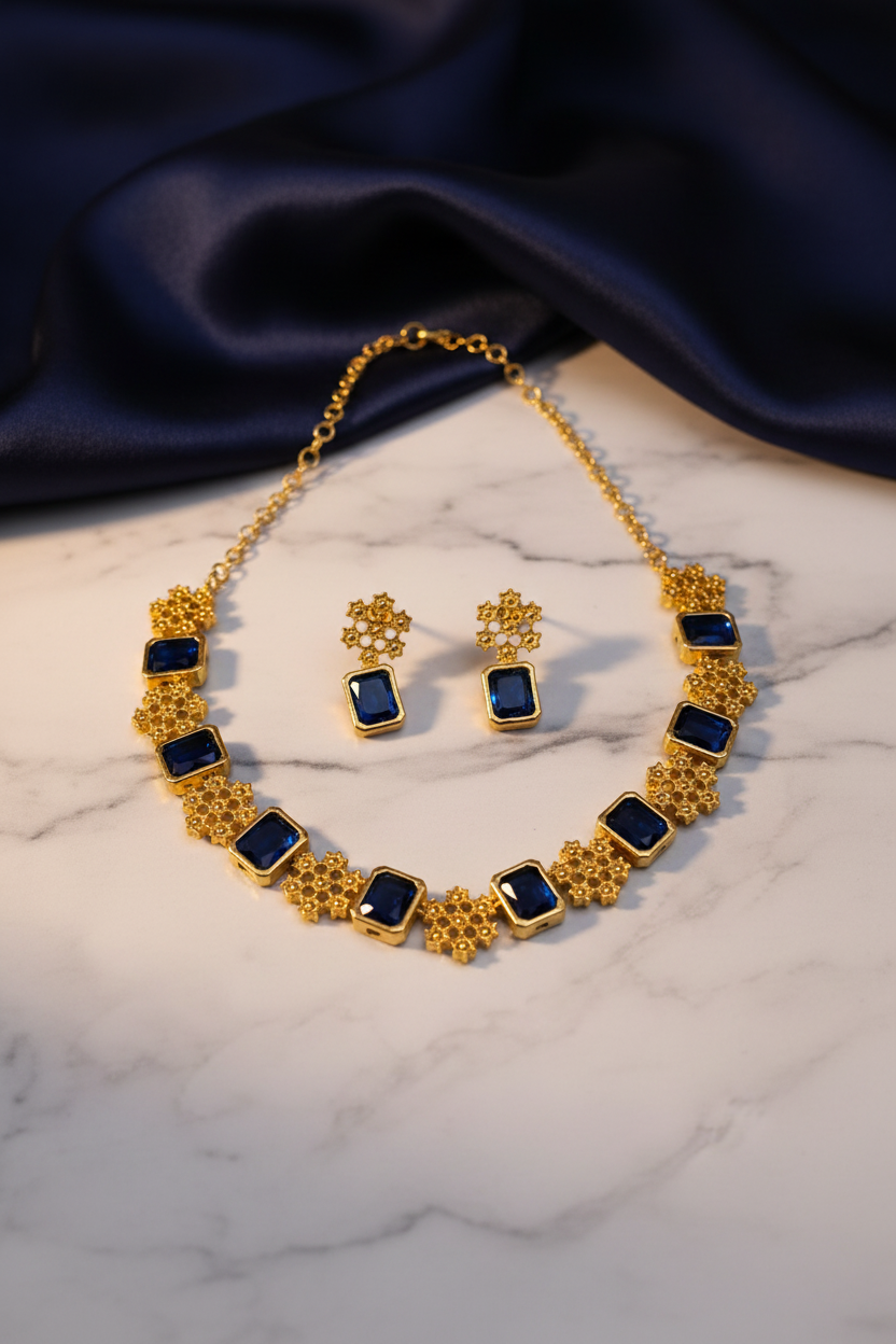 Gold and Sapphire Necklace Set with Elegant Background