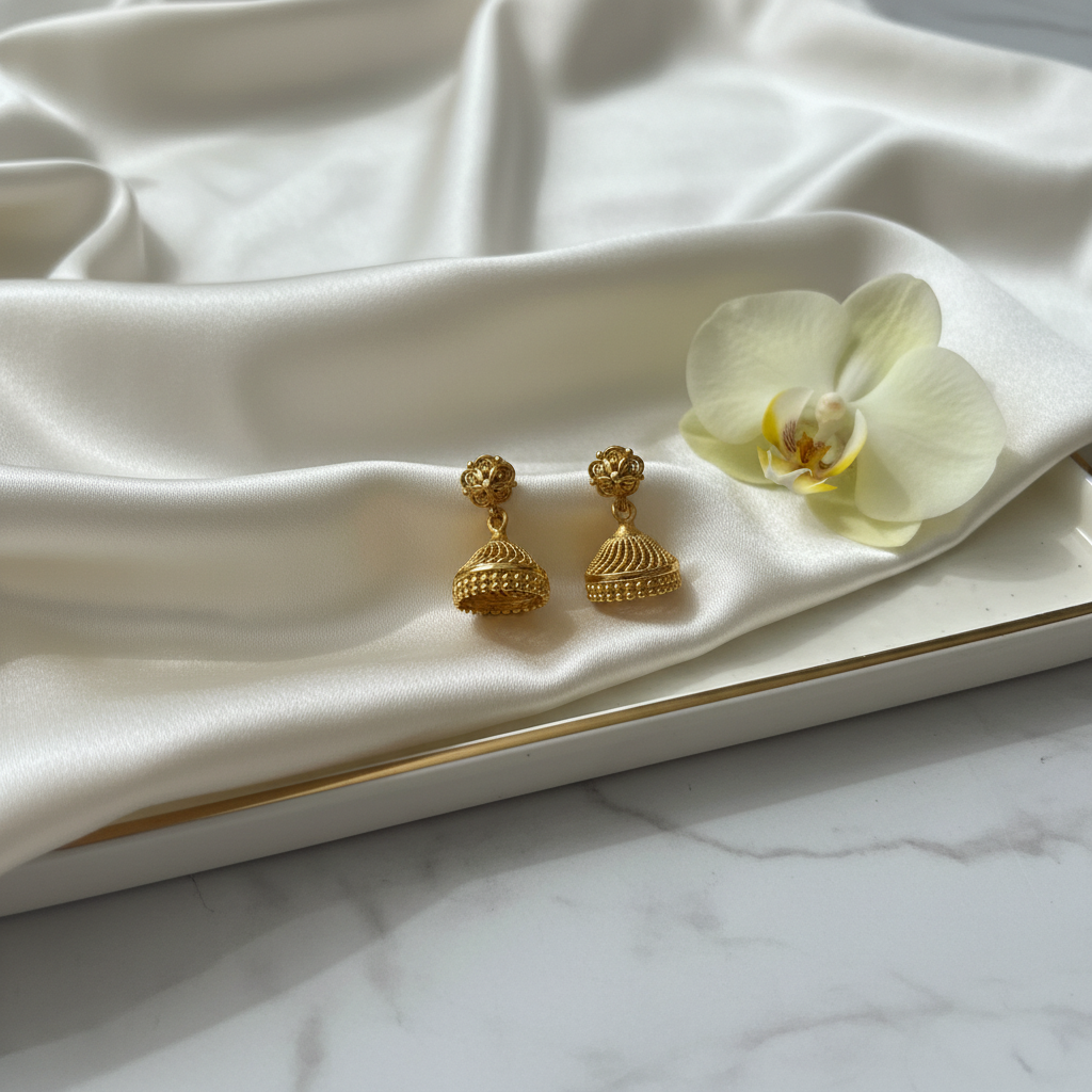 Gold jhumka earrings styled without box