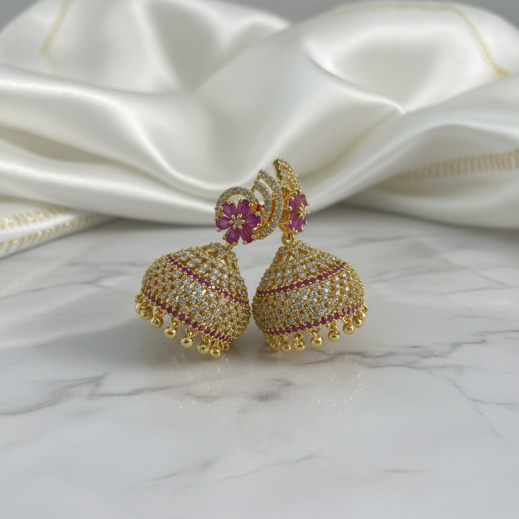 Gold jhumka earrings with purple gemstones - premium photography