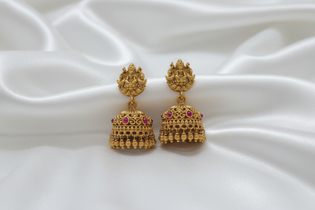 Temple jhumka earrings with elegant background